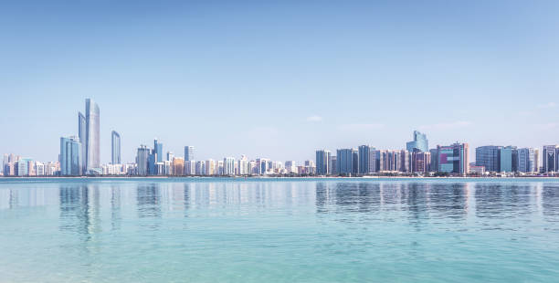 istock Abu Dhabi Skyline with skyscrapers with water 1165897310