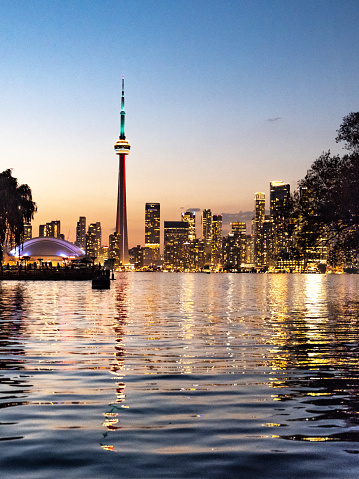 Toronto, Ontario, Canada - July 28, 2019:  The Toronto city skyline as seen from Centre Island at dusk.