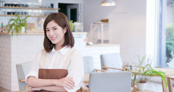 istock young asian shopkeeper smile 1165899242