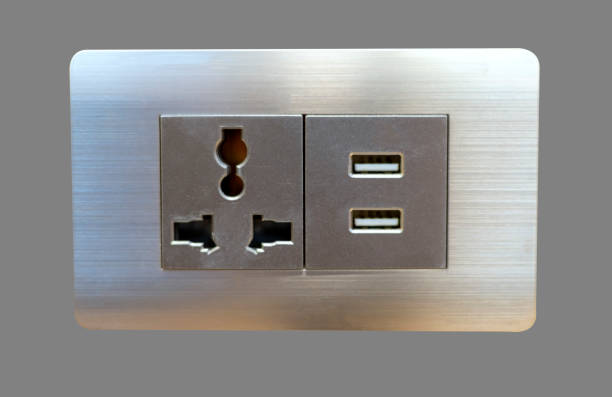 Electric wall plug socket and USB charging port isolate on gray background.