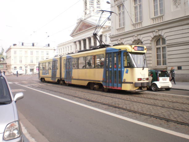 Nice Yellow Tram Circling The Streets In Brussels. stock photo