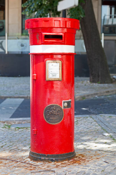 Lisbon, Portugal - June 02 2018: Traditional red Portuguese public mailbox (Correio) based on the same model as its British counterpart.