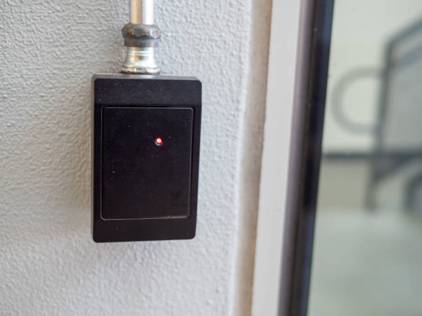 istock Black electronic keycard reader scanner outside of building entrance 1165906391