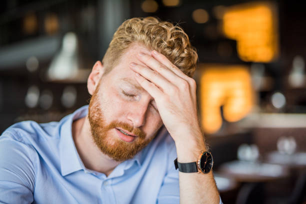 istock Frustrated young businessman having a headache. 1165906640
