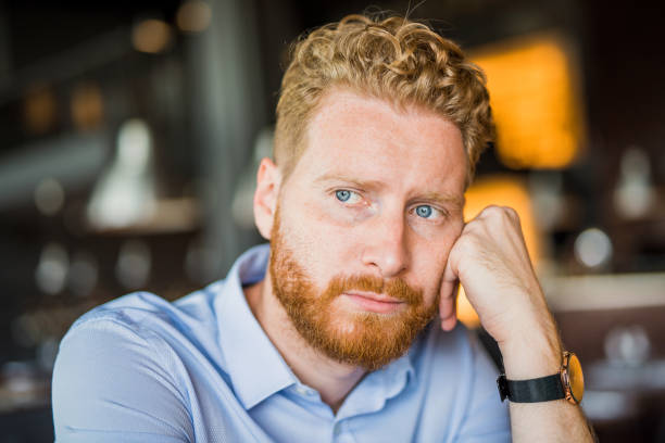 istock Worried young man contemplating. 1165906746