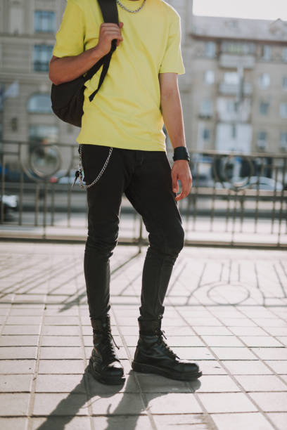 istock Street style man in jeans and heavy leather boots 1165908052