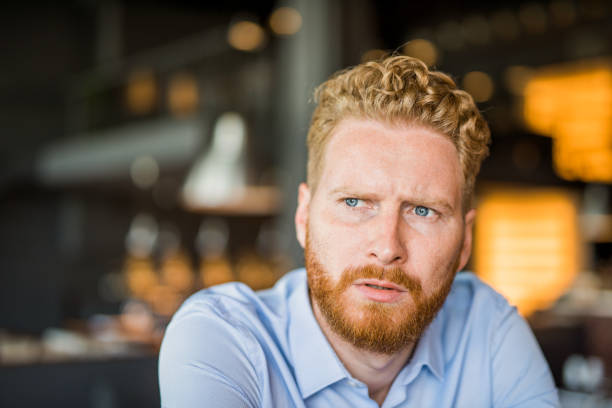 istock Confused and suspicious young man contemplating. 1165908226