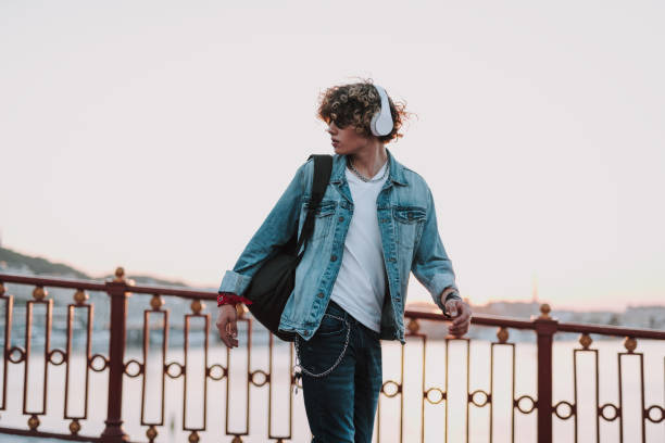 istock Calm man is walking on the bridge 1165913546