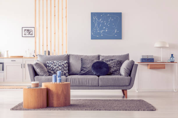 istock Abstract blue painting on empty white wall of open plan apartment 1165916799