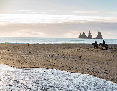 Horse-riding on Icelandic beach.