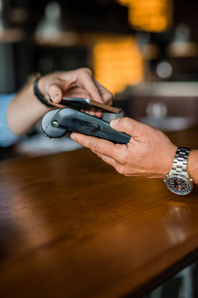 istock Contactless payment with a phone. 1165925885