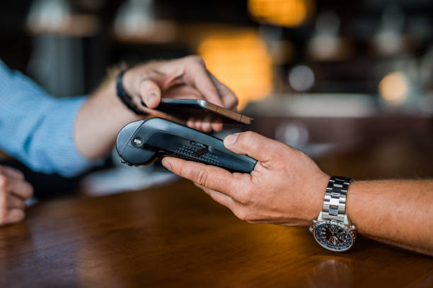 istock Contactless payment with a phone. 1165926147