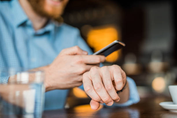 istock Connecting a phone to a smart watch. 1165926174