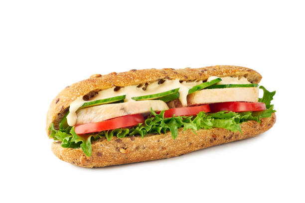 istock Whole grain sandwich with chicken and vegetables on white 1165928204