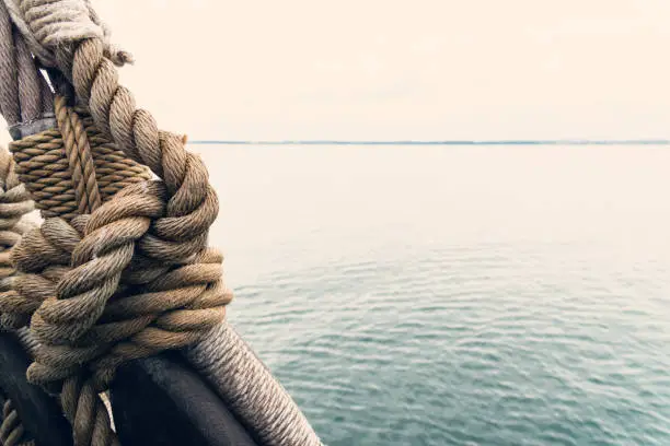 Nautical knot of rope in front of the sea