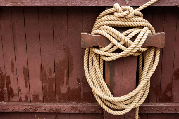 Wooden ship deck background with old rope