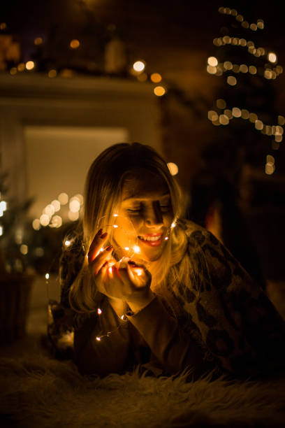istock Playful girl with lights 1165933387
