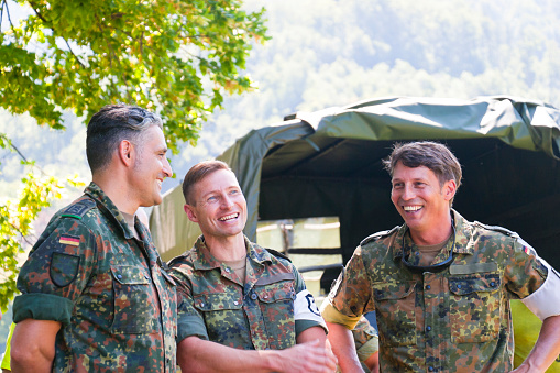 Three joking army officers