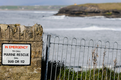 Sign at a sea front saying 