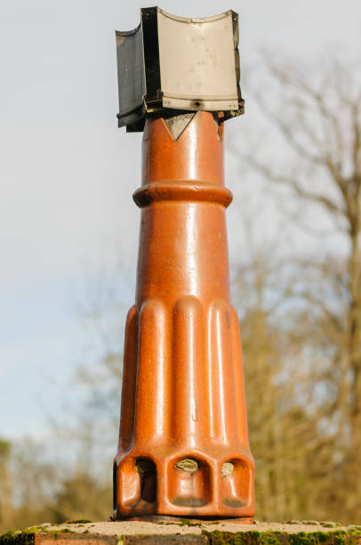 istock Cowling (to prevent down draughts) on an old chimneypot 1165938870