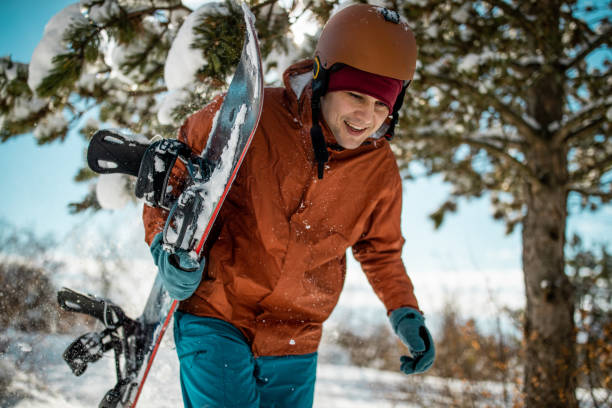 istock Snowboarder and snowflakes 1165940051