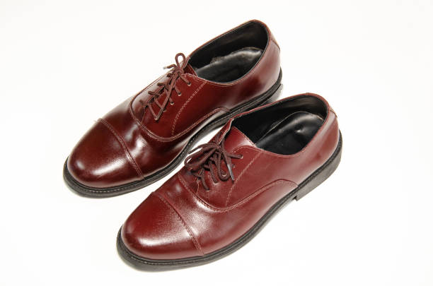istock Brown leather shoes photos Put on a white background 1165946400