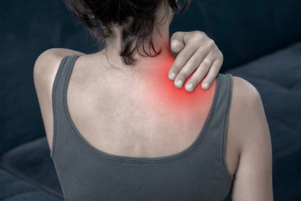 istock Woman With Neck And Shoulder Pain 1165947151