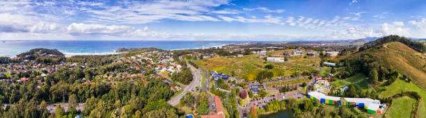 D Coffs Harbour Banana 2 sea pan Coffs Harbour regional town on Australian Mid North coast of NSW - the big banana town at the centre of banana palm farms and agriculture industry. Wide aerial panorama over suburbs and coast. coffs harbour stock pictures, royalty-free photos & images