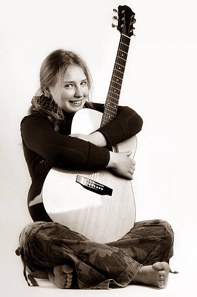 istock young girl and hers guitar 116595364