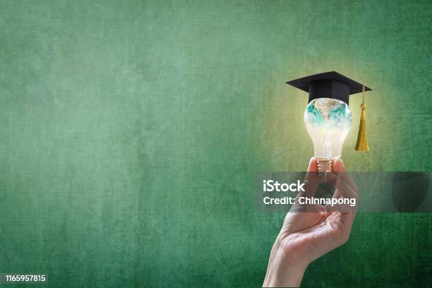 Innovative Learning Creative Educational Study Concept For Graduation And School Student Success With World Lightbulb On Teacher Chalkboard Stock Photo - Download Image Now