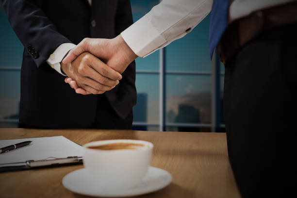istock successful cooperation and confident partner concept, people shake hands with customer after successful agreement business 1165962480