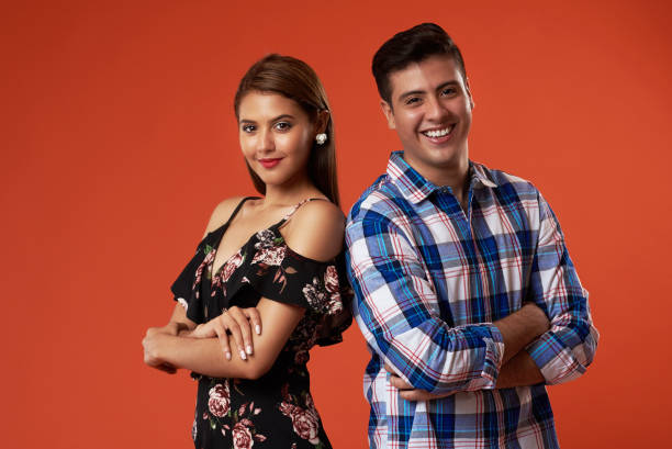 istock Young couple with crossed arms 1165965294