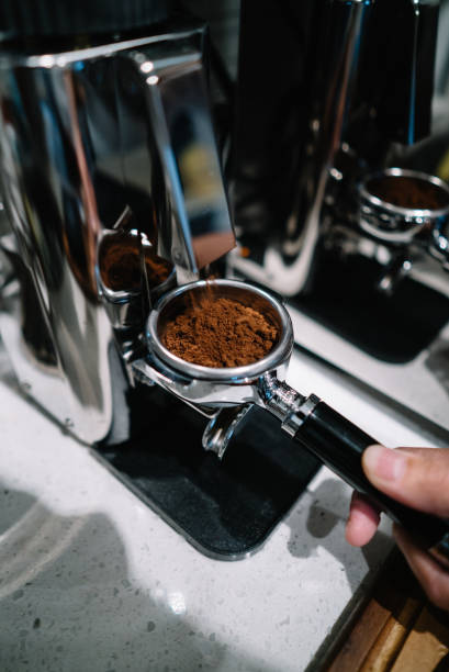 istock Coffee being grinded and goes into portafilter at home 1165972048