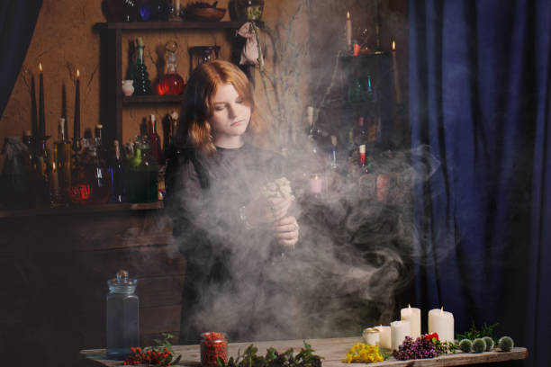 istock young witch in home. Halloween concept 1165976353