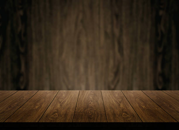 istock Wood table in front of wood wall blur background. 1165980677
