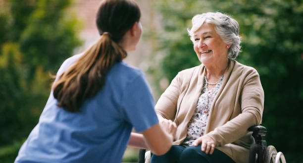 Getting outside was a lovely suggestion Shot of a senior woman in a wheelchair being cared for a nurse sheltered housing stock pictures, royalty-free photos & images