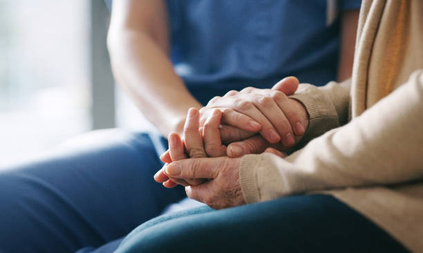 You're in a safe space now Cropped shot of a senior woman holding hands with a nurse holding hands stock pictures, royalty-free photos & images