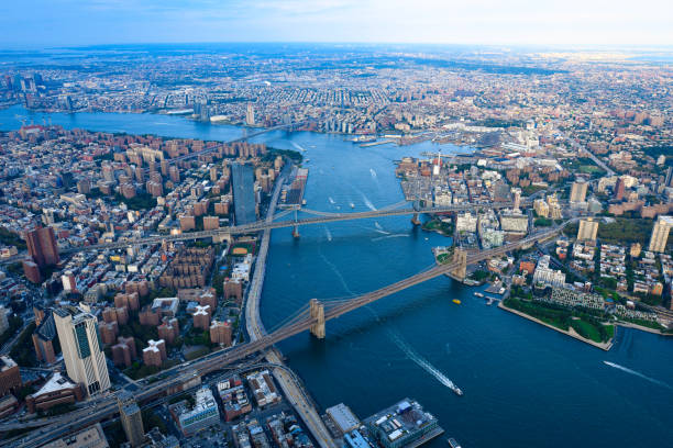 The 3 Bridges & East River - New York City An overhead view of the Three Bridges in Lower Manhattan williamsburg bridge stock pictures, royalty-free photos & images
