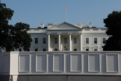 views of the White House from the front with lots of barriers and fences.