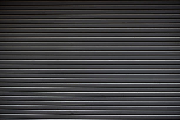 Rolling Steel Doors Closed rolling steel doors. shutter door stock pictures, royalty-free photos & images