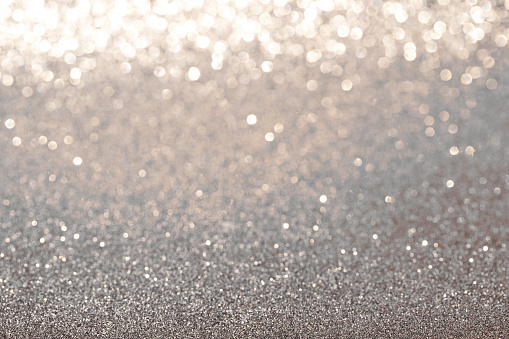 Background of silver glitter texture. Christmas abstract background