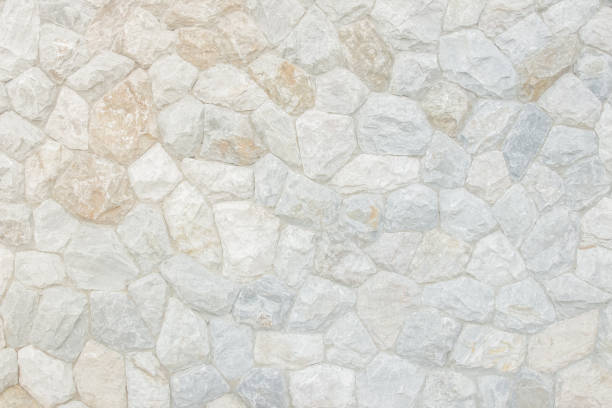 istock Brick stone wall stack of medieval natural stone texture background or rock strata boundary the rock seamless abstract and fragment of a walls from a gray. 1165988831