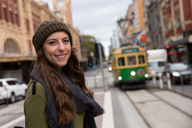 Smiling Woman Waiting for Tram stock photo