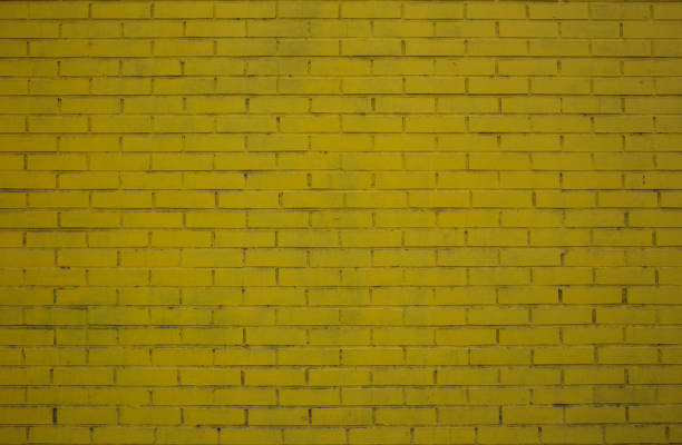 istock Background of yellow brick wall 1165992153
