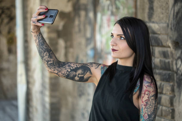 istock Woman taking a selfie 1165993923
