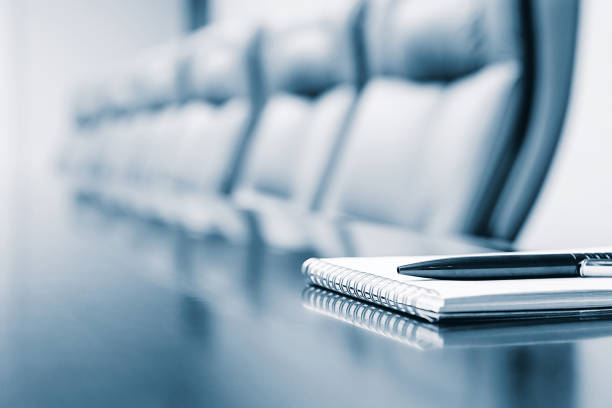 Close up of notepad kept on table in empty room