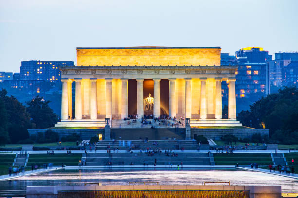 istock Lincoln memorial reflected on the reflection pool when dusk at nation mall. 1165994751