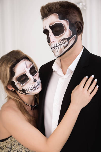 istock A couple with skeleton make up for Halloween or All Souls Day 1165996026