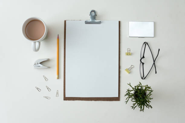 istock notebook flat lay on white background with summer leaves and other stationery in trendy set up style 1165998032