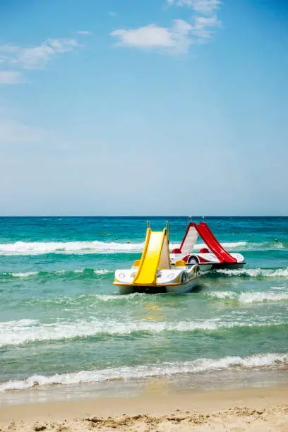 One pedal-boats with water slides on the beach in Halkidiki, Greece.